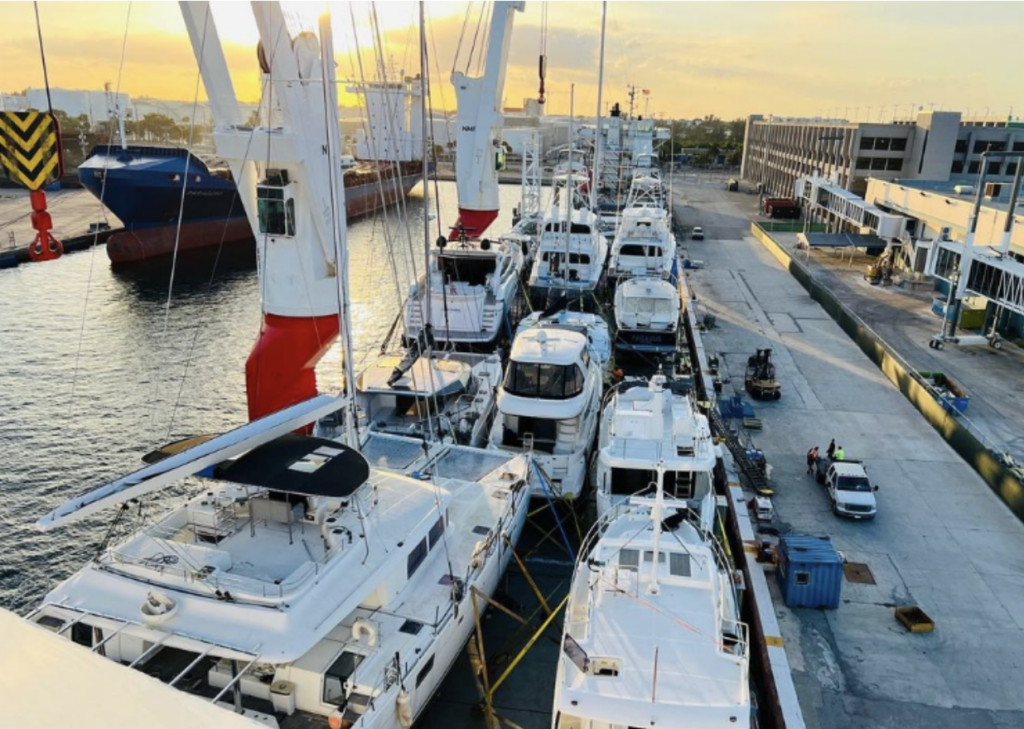 The deck of a Heavy Lift Transport Vessel with the deck full of yachts being transported by Cross Chartering