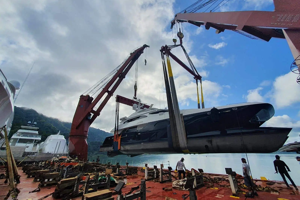 A lift-on-lift-off operation for a superyacht performed by Cross Chartering Yacht Transport.